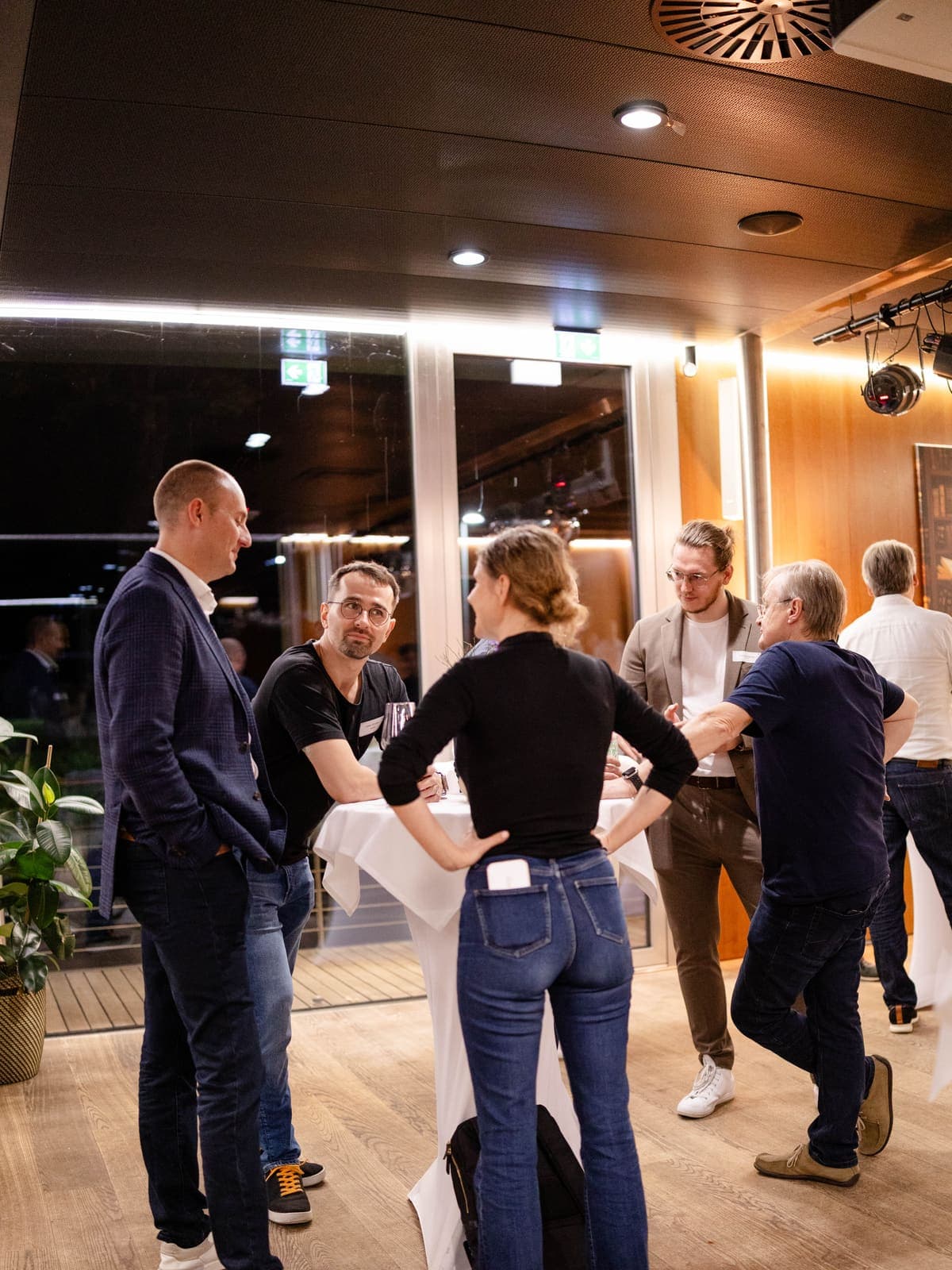 Community members networking at an evening reception