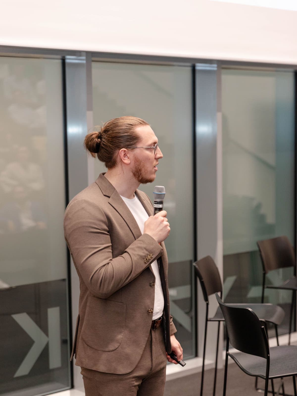 Speaker presenting at a Young AI Leaders event