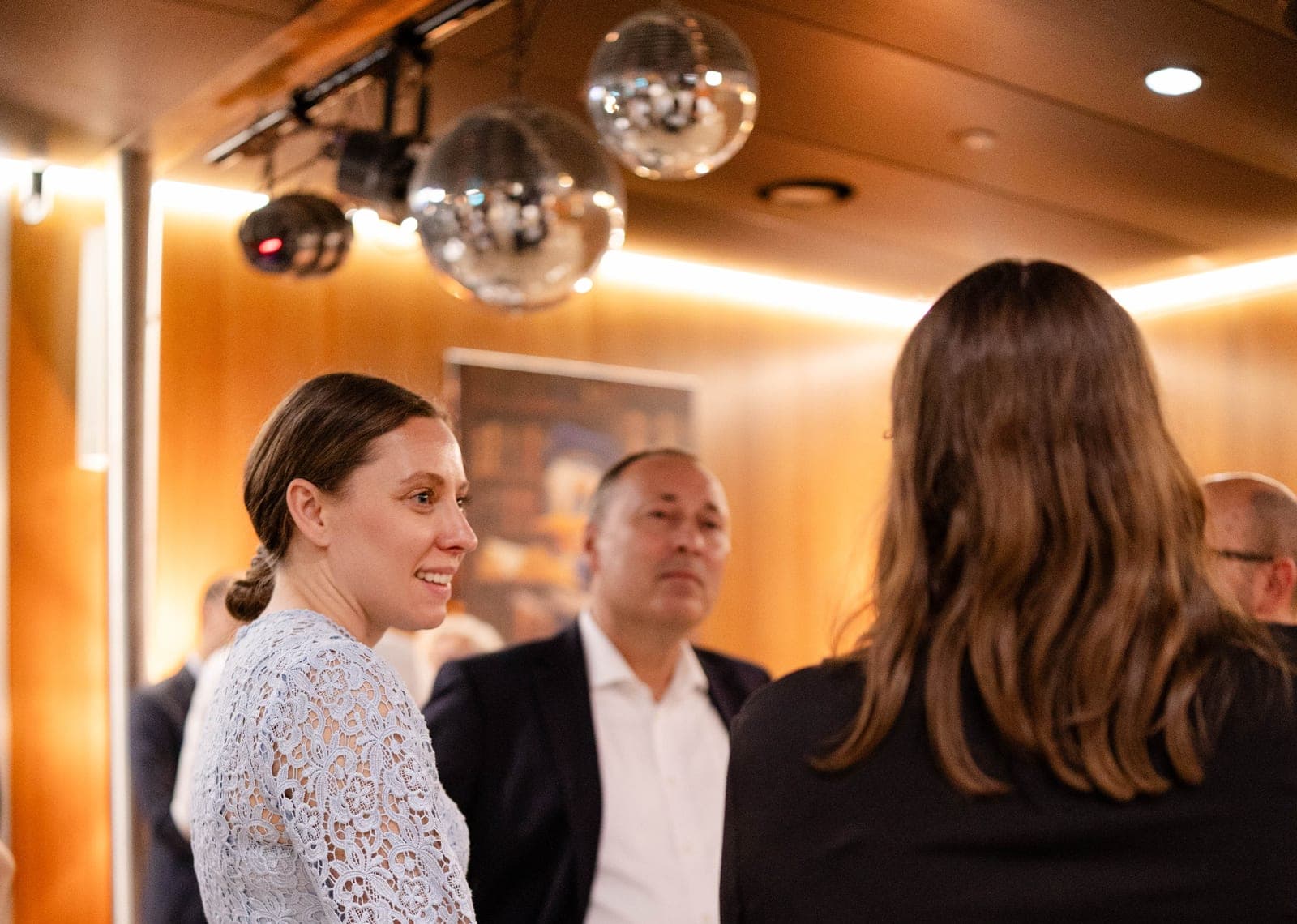 Founders and partners networking at an evening reception
