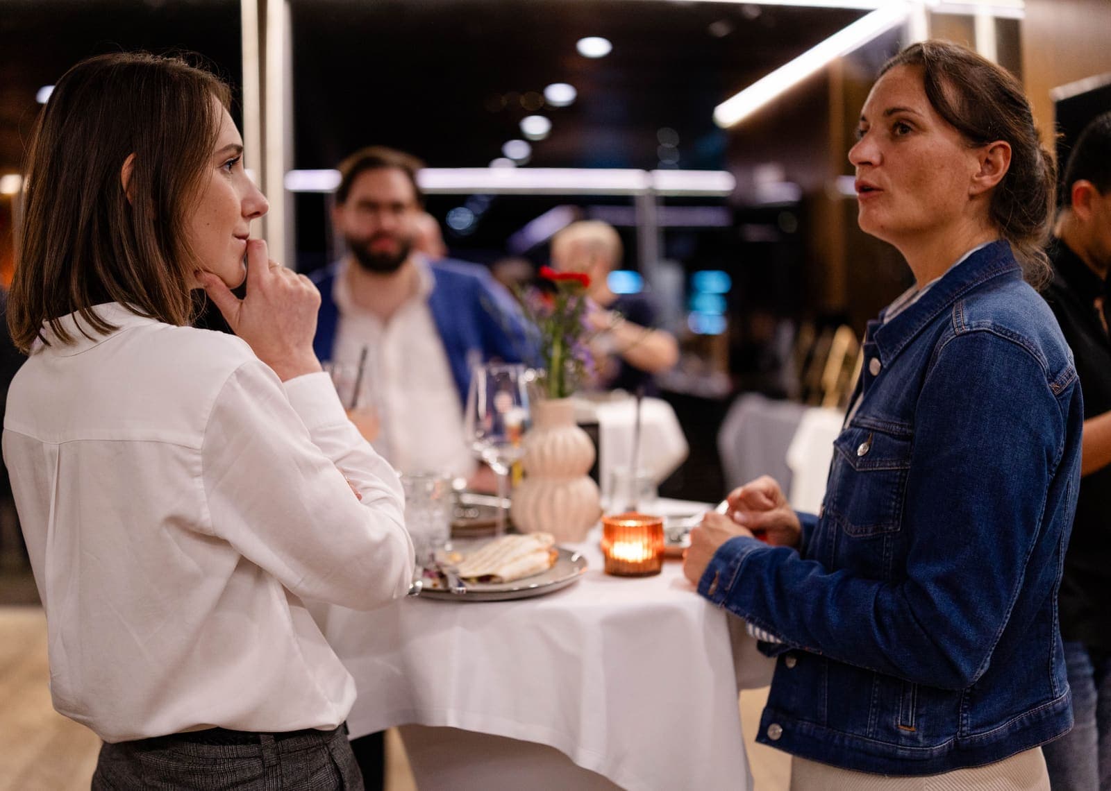 Two professionals in conversation at a partner event